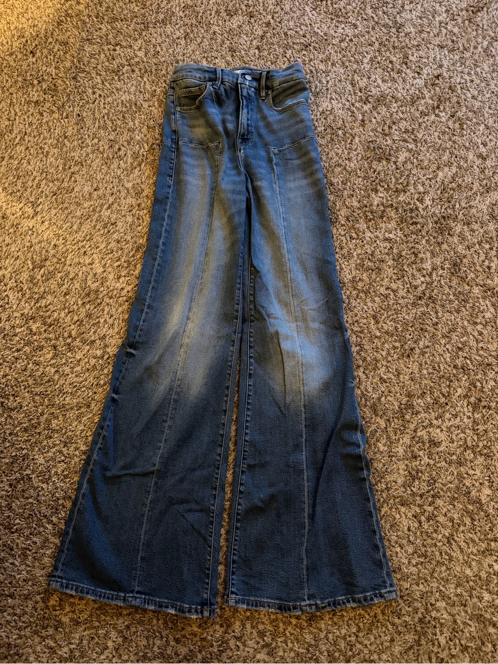 Good American Dark Blue Wide Leg Jeans with front and back detail.